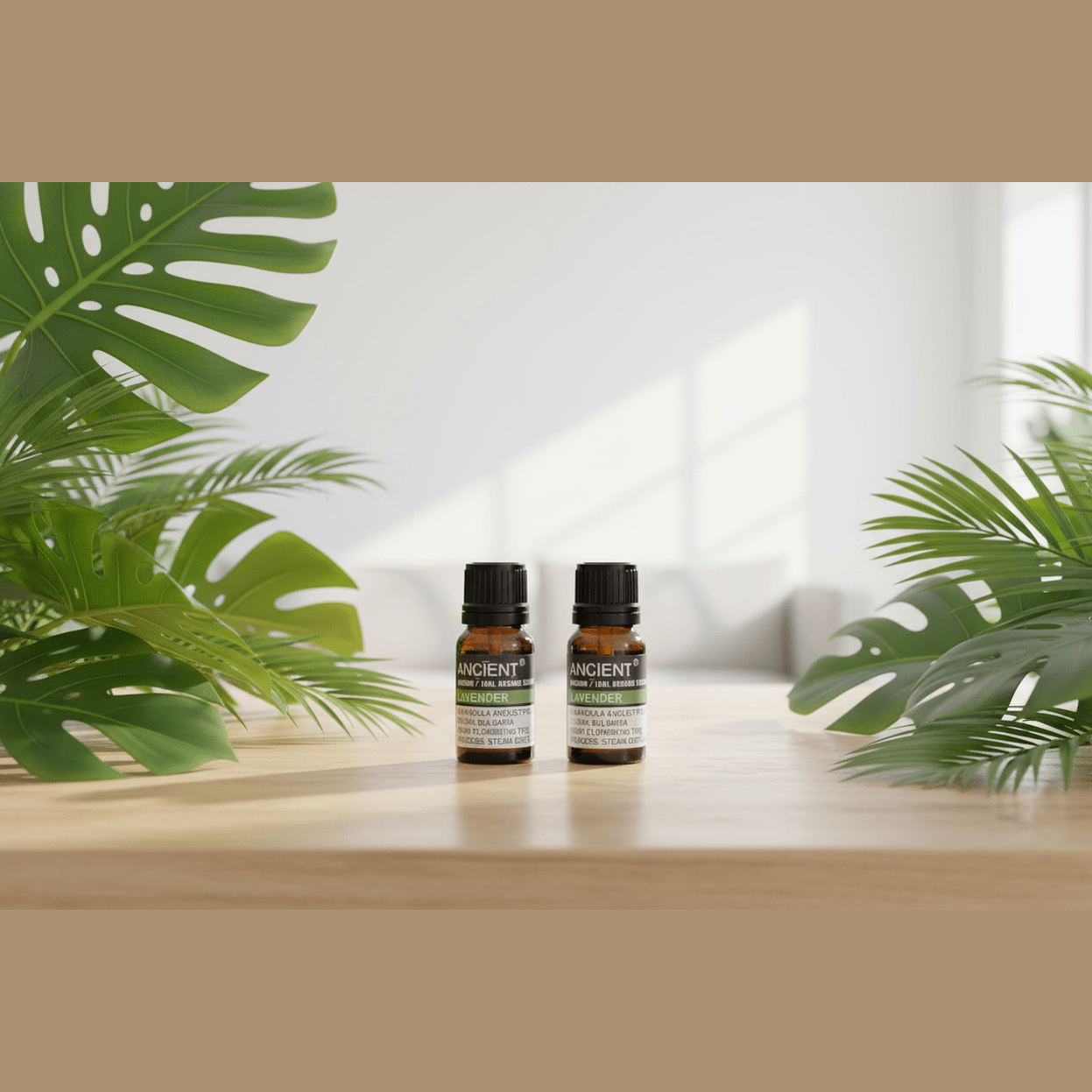 Two bottles of organic essential oil on a wooden surface with green plants in the background.