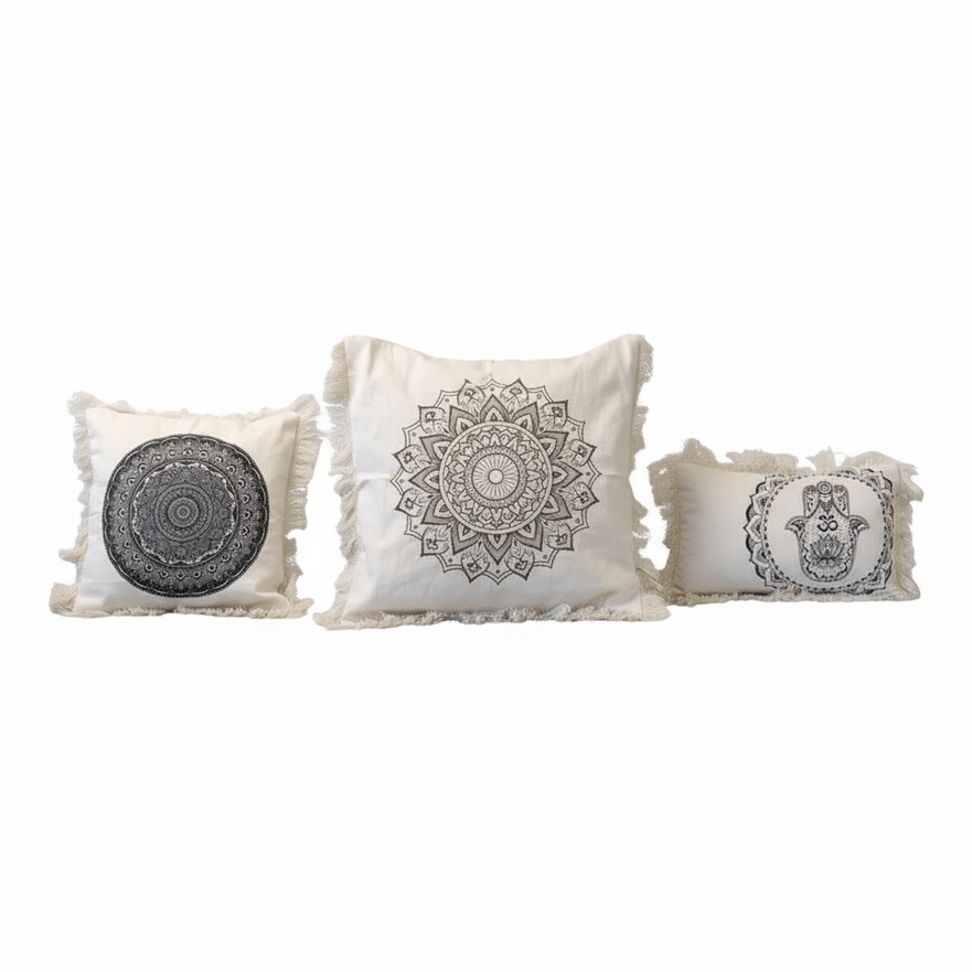 Three decorative pillows with mandala patterns on a white background