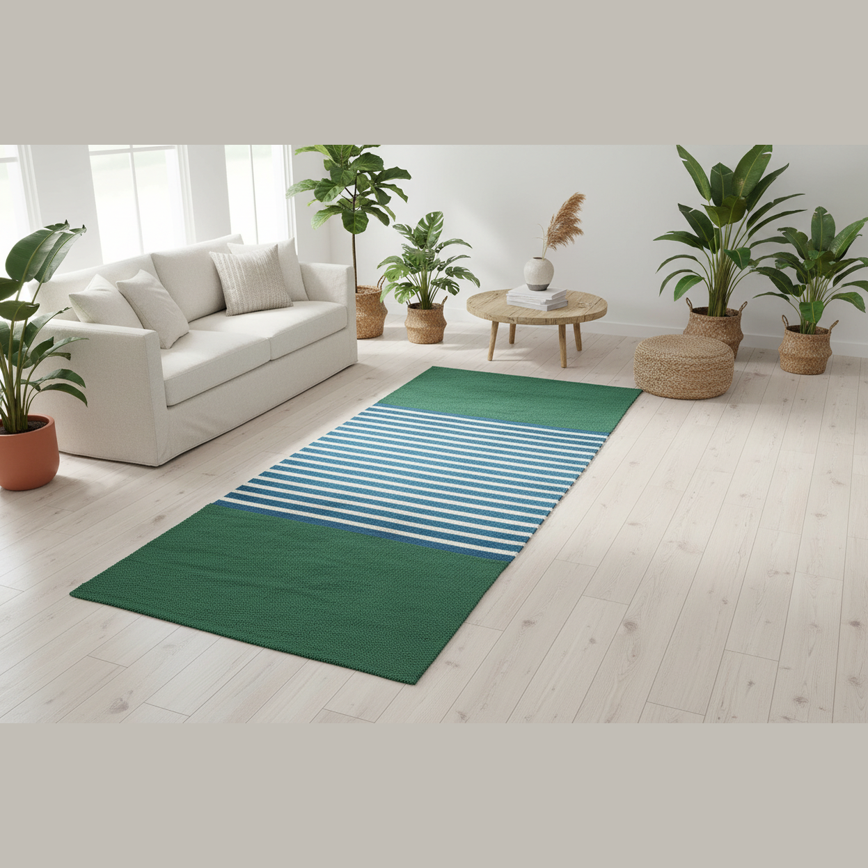 Green and blue striped rug on a light wooden floor with a white couch and potted plants in a bright room.