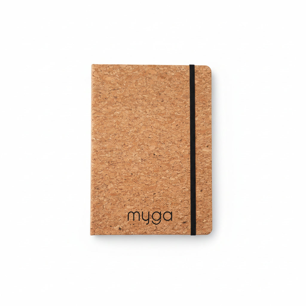 Cork notebook with black strap on a white background, branded 'myga'.