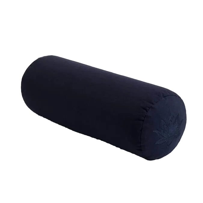 Black cylindrical yoga bolster on a light gray background
