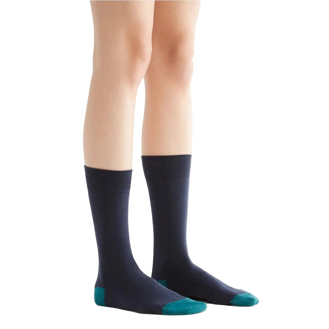 Navy socks with teal accents worn by a person on a white background