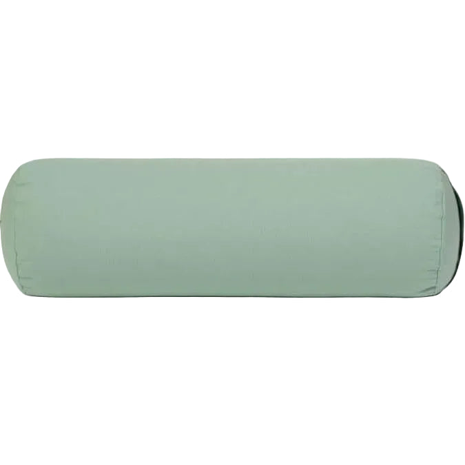 Green yoga bolster on a light gray background