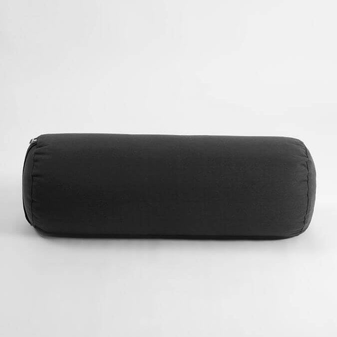 Black cylindrical pillow on a white background
