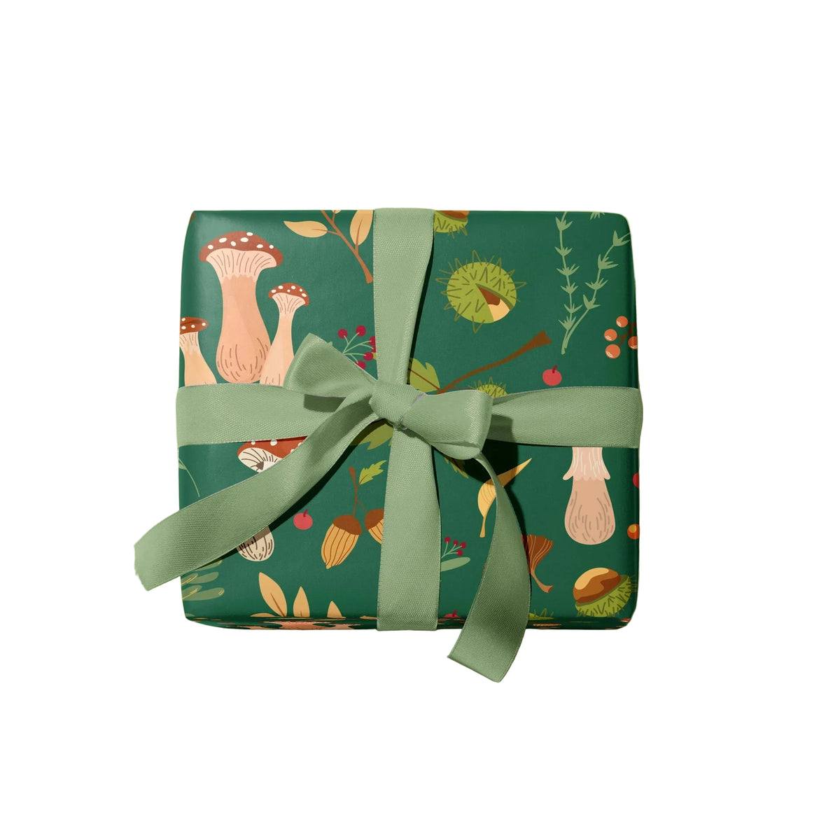A square gift box wrapped in dark green paper with a whimsical forest pattern of mushrooms, acorns, leaves, and berries, tied with a matching sage green ribbon and bow, on a solid white background.