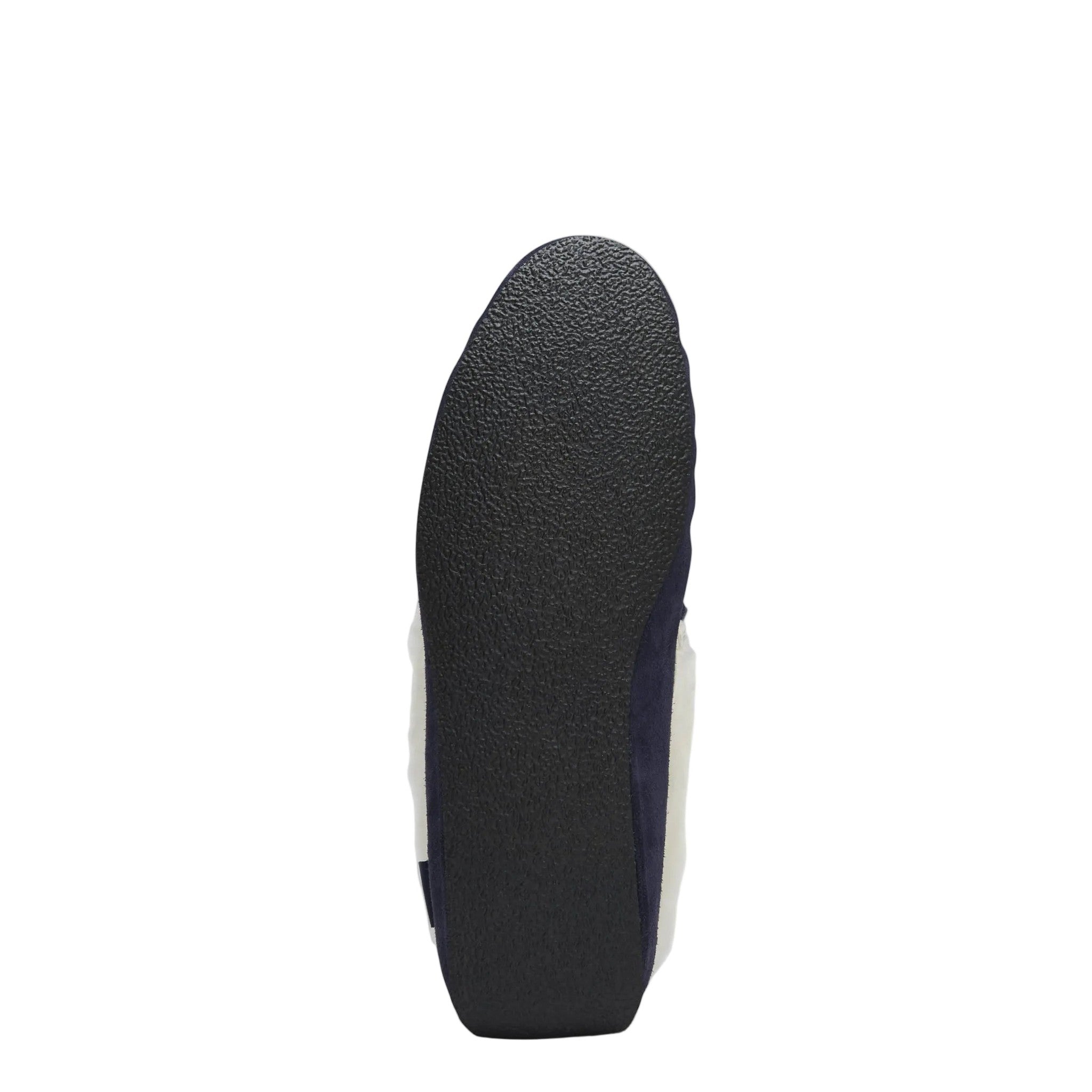 Black sole of a shoe on a light gray background