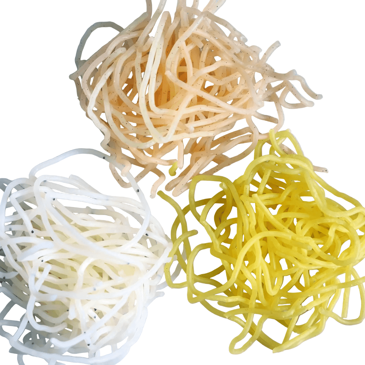 Three nests of thin noodles in white, beige, and yellow on a white background