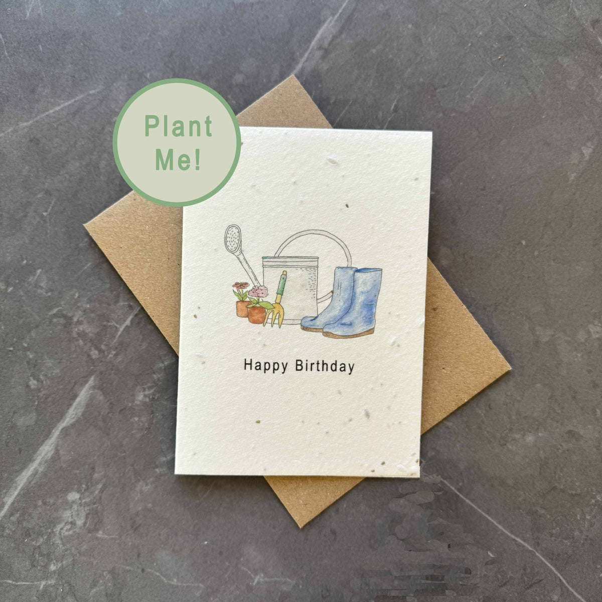 Birthday card with gardening illustration and 'Plant Me!' tag on a gray background