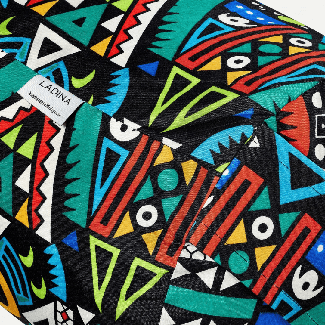 Colourful geometric patterned fabric with 'LADINA' label