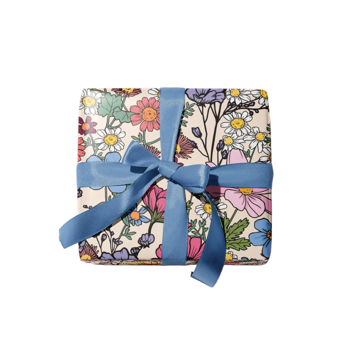 A square gift box wrapped in cream-colored wrapping paper with a colorful floral pattern and tied with a blue satin ribbon bow, shown on a plain white background.