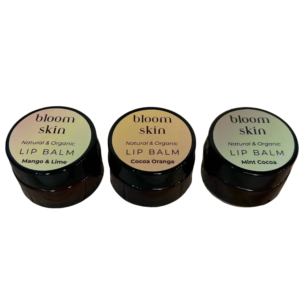 Three lip balm containers from bloom skin on a white background