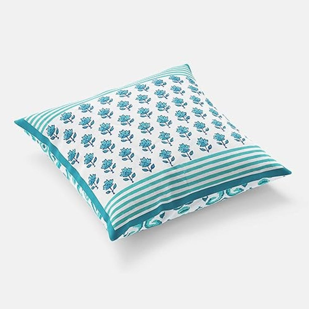 Decorative pillow with blue floral pattern on a white background