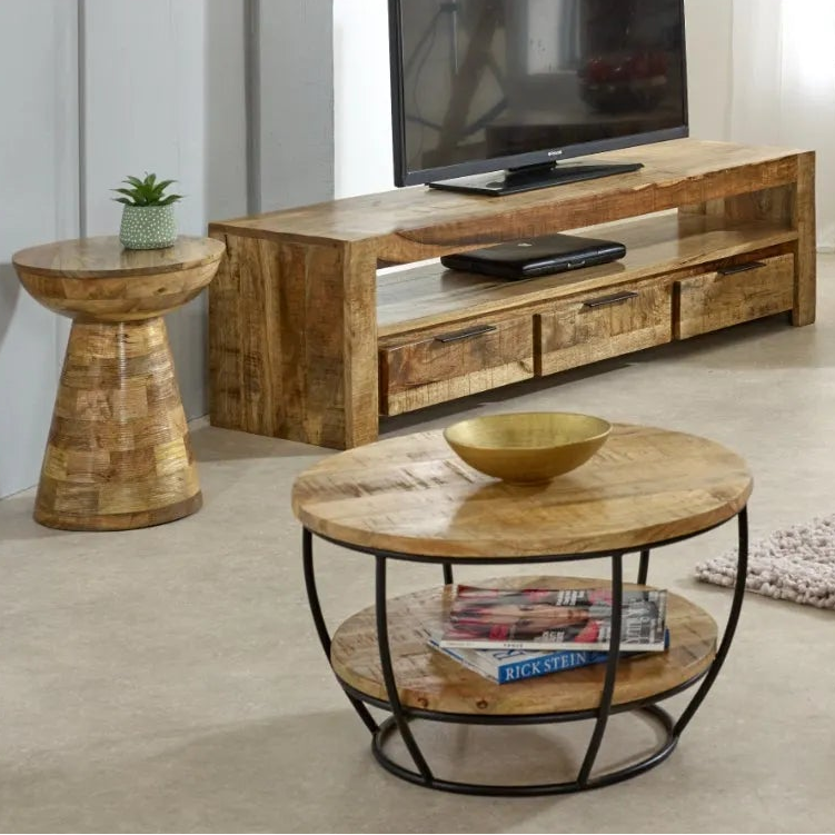 Living room with wooden furniture including a TV stand, coffee table, and side tables.