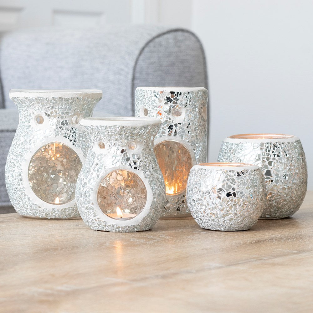 Set of decorative candle holders on a wooden surface with a blurred background
