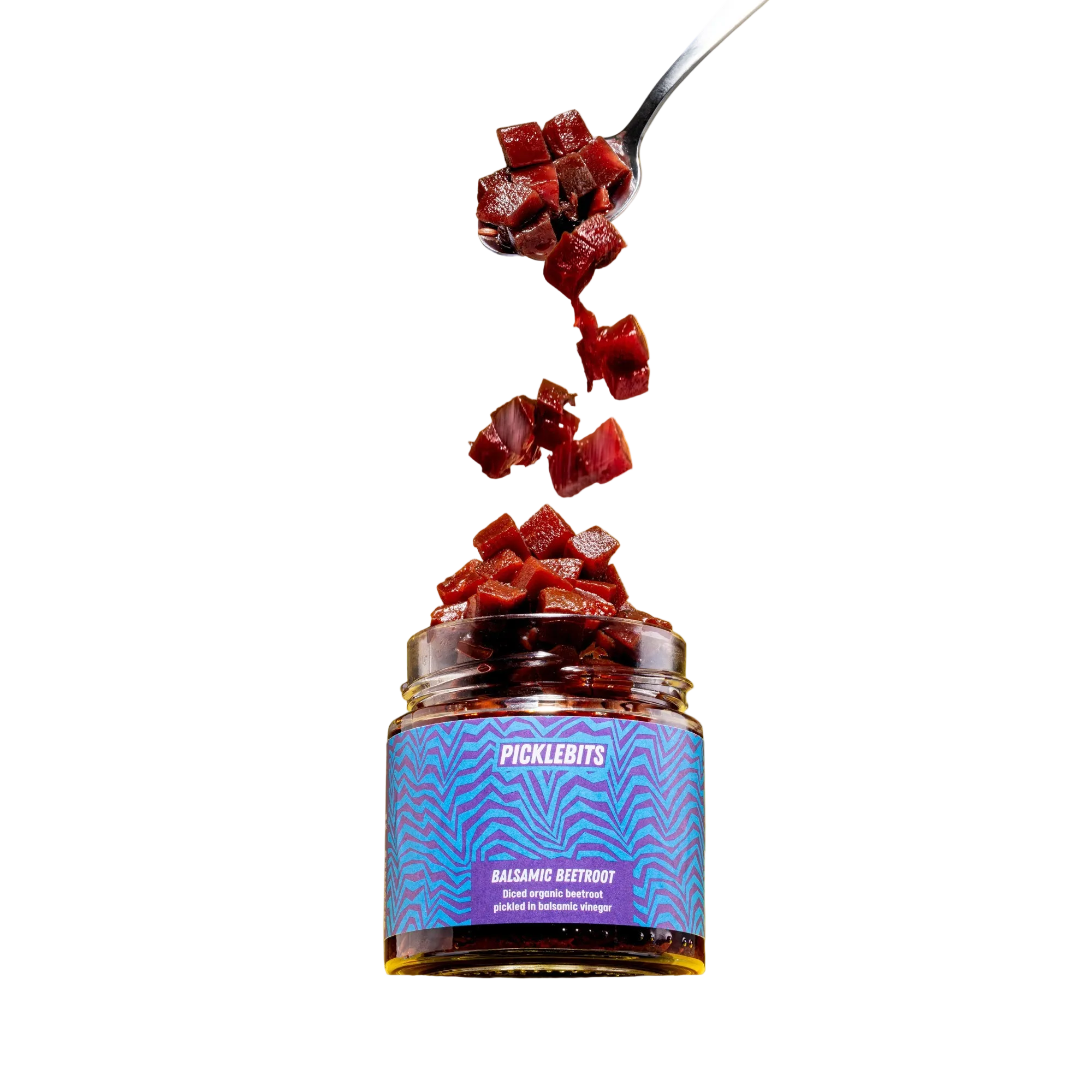 Jar of Picklebits Balsamic Beetroot with a spoonful being lifted out on a white background