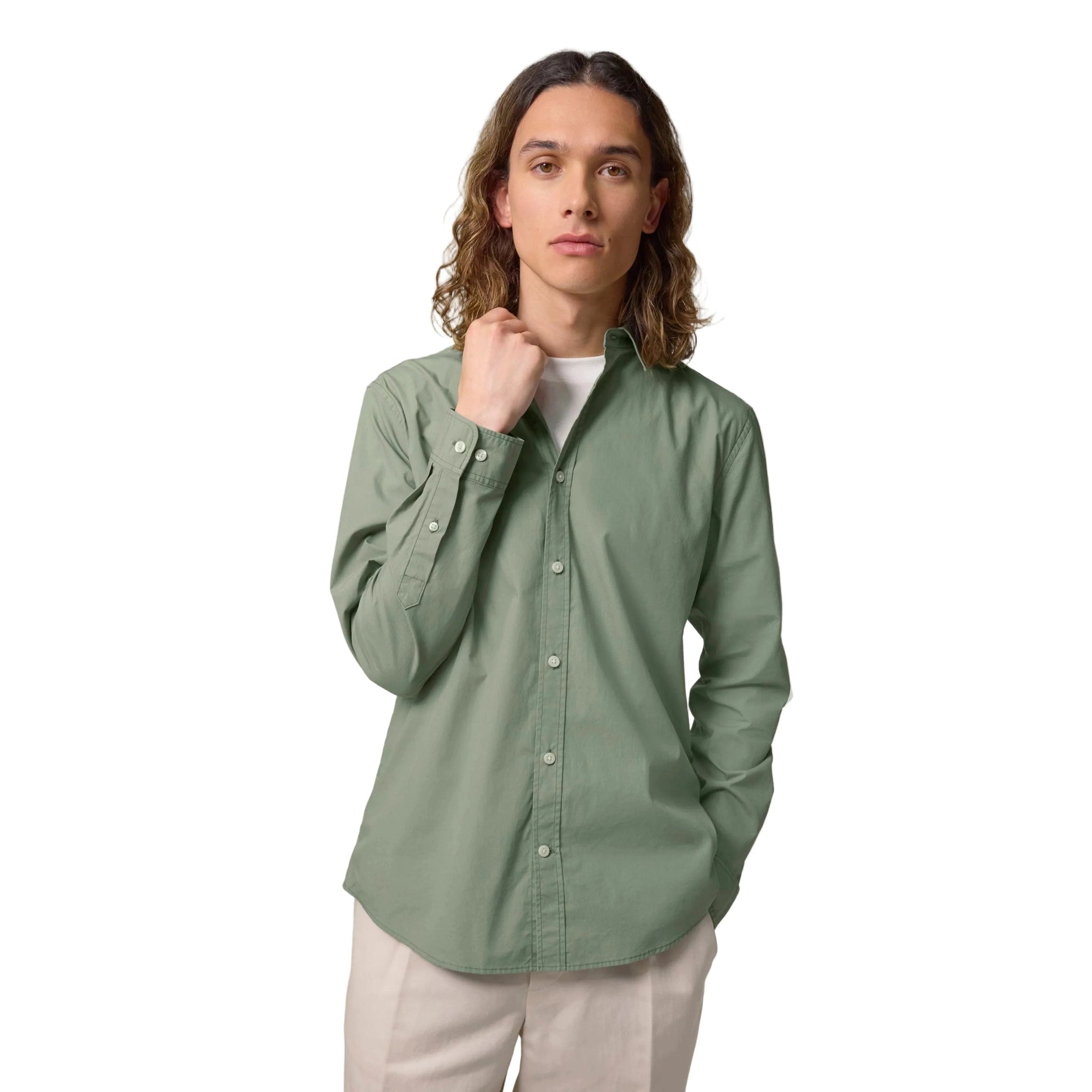 Man wearing a green button-up shirt on a white background