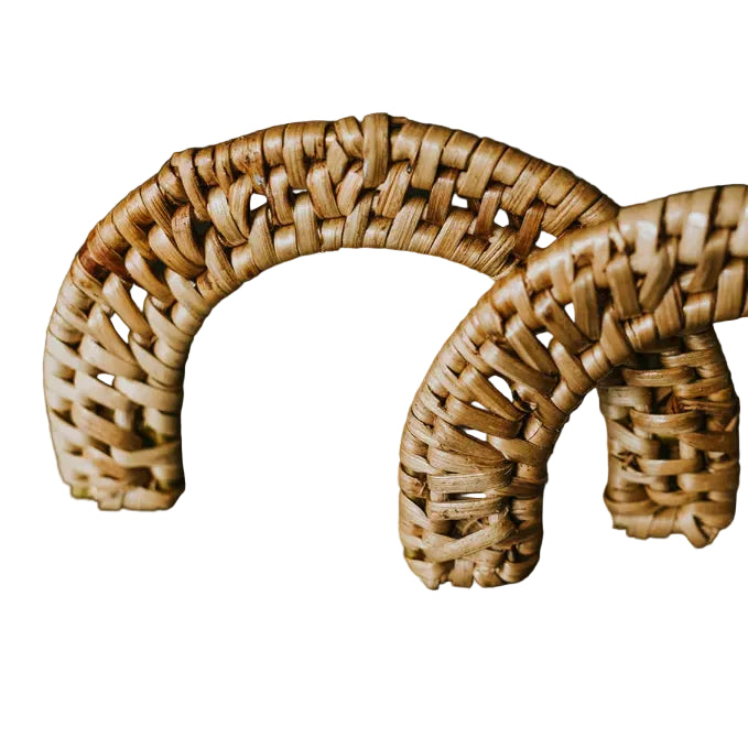 Close-up of two Dunstanburgh half moon rattan handles showing their woven texture on a white background