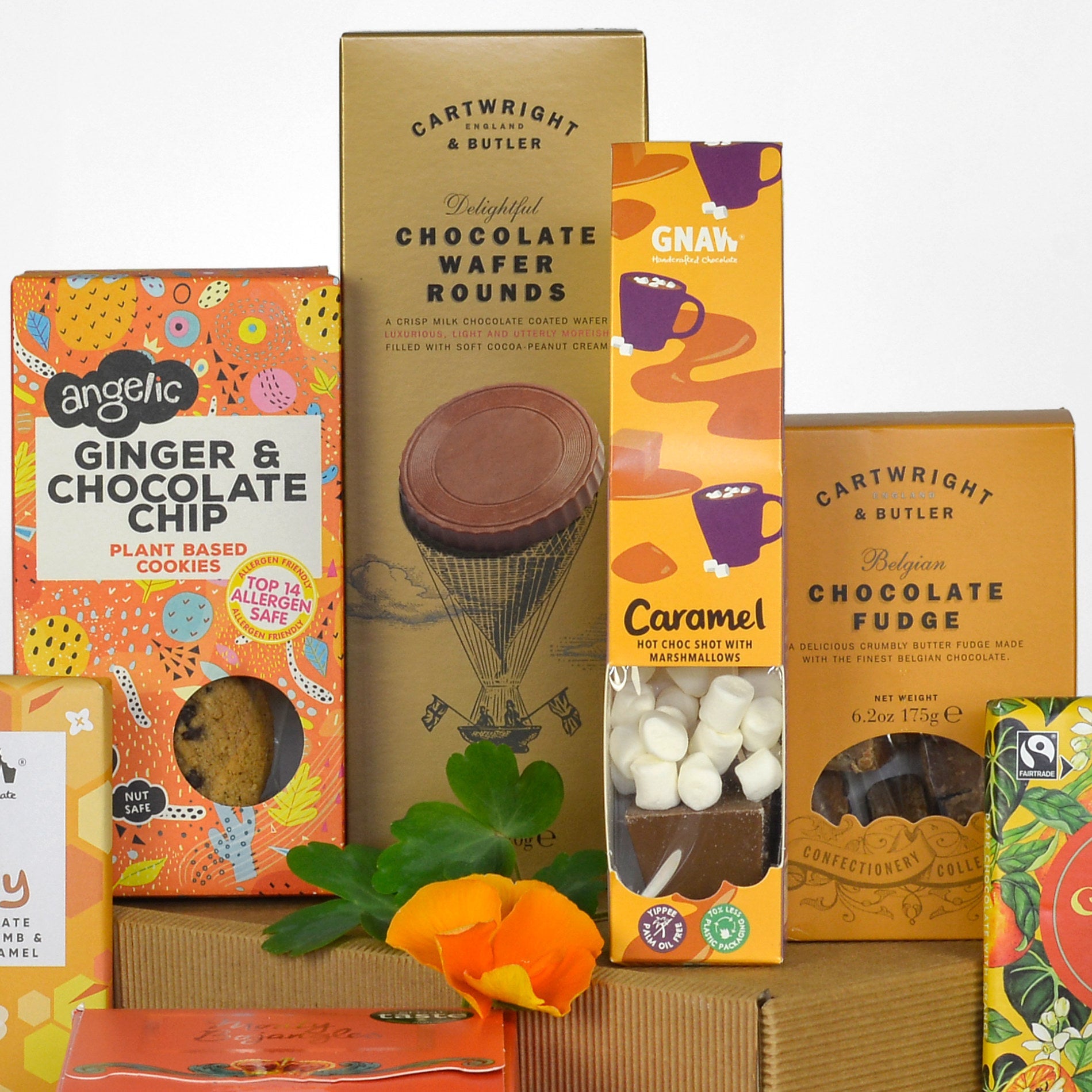 Assorted chocolate and cookie packages with visible branding on a white background