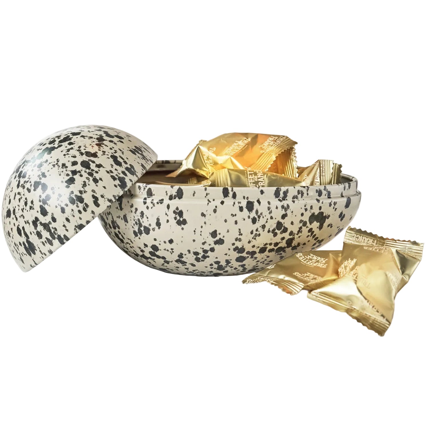 Speckled Easter egg-shaped container with gold-wrapped chocolates on a white background