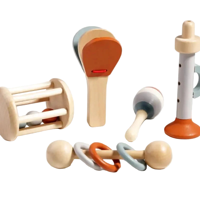 Set of wooden baby toys on a light background