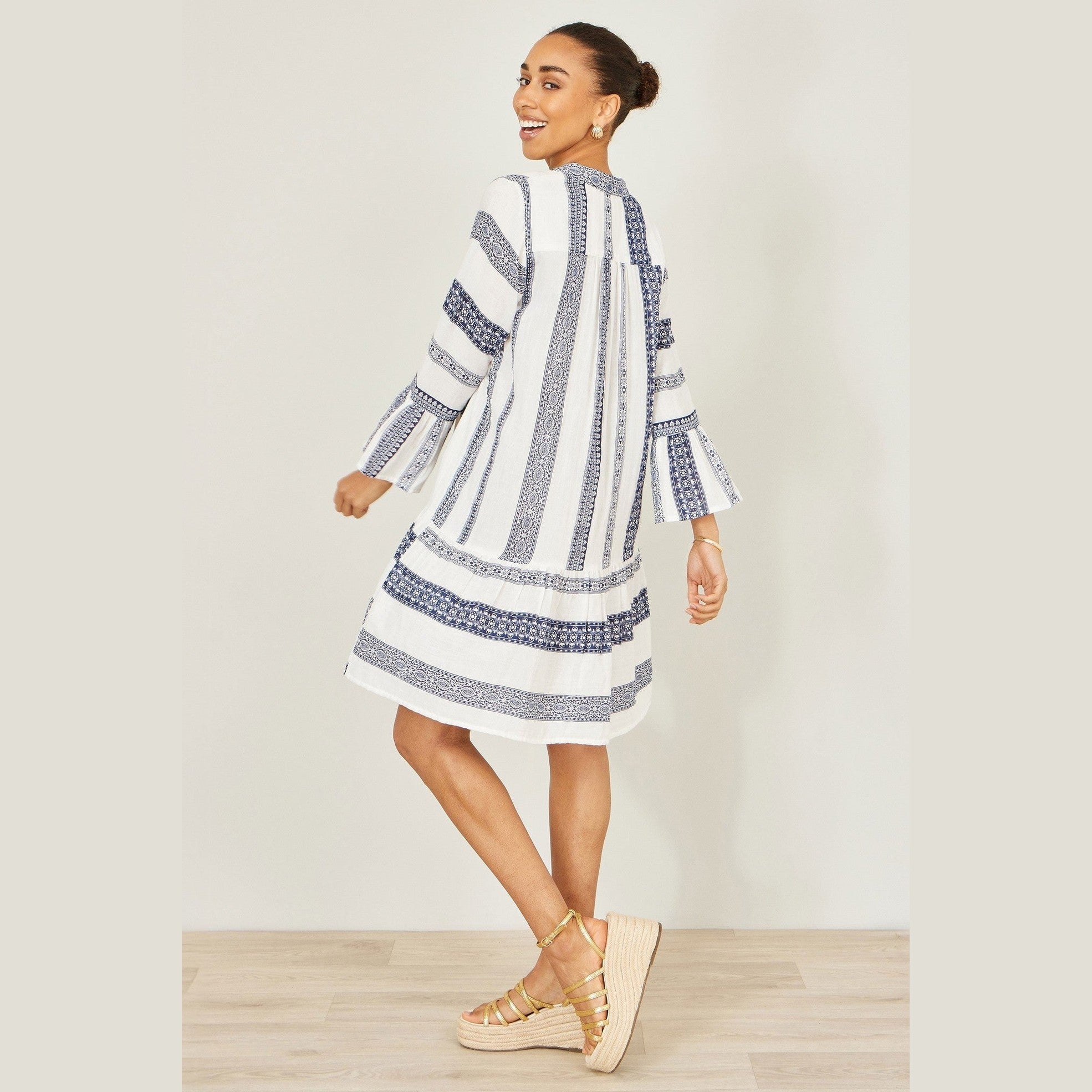 flared-sleeve tunic dress
