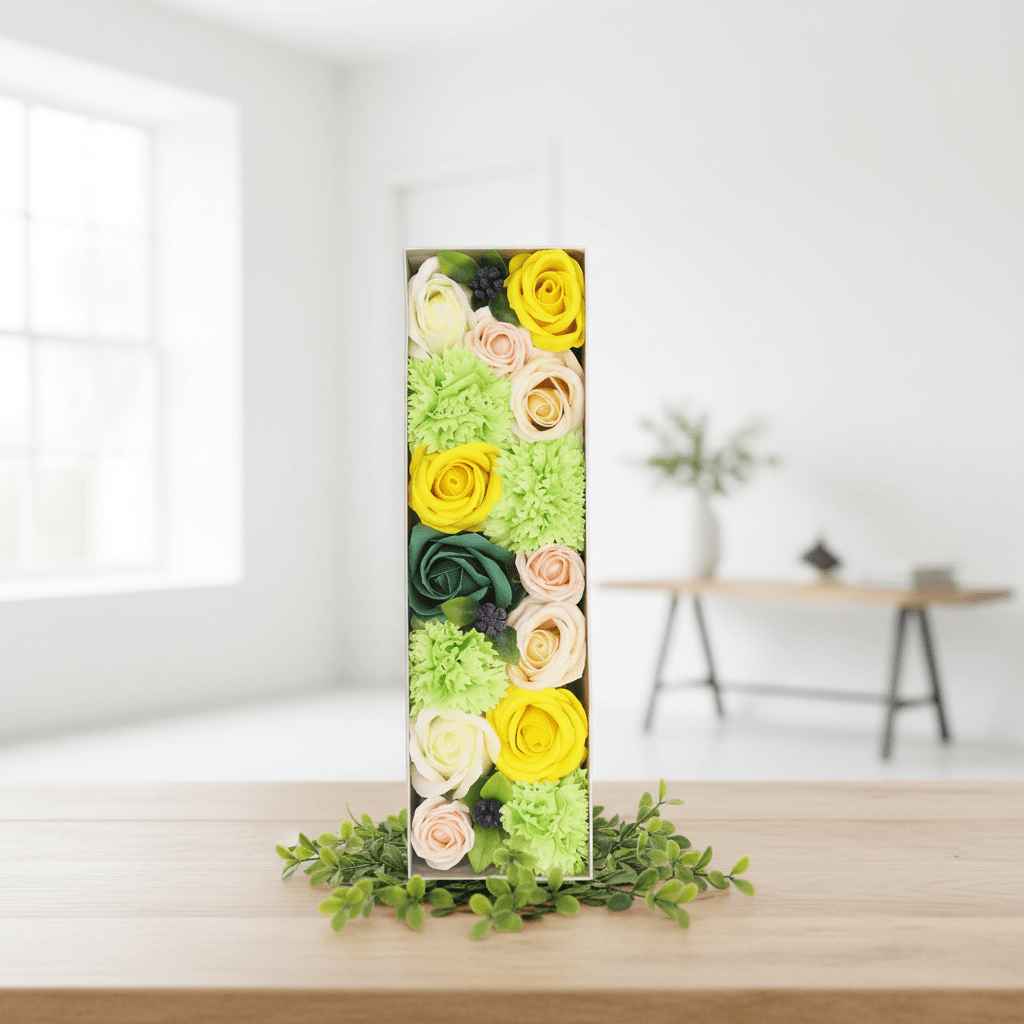 Colorful floral arrangement in a box on a white background