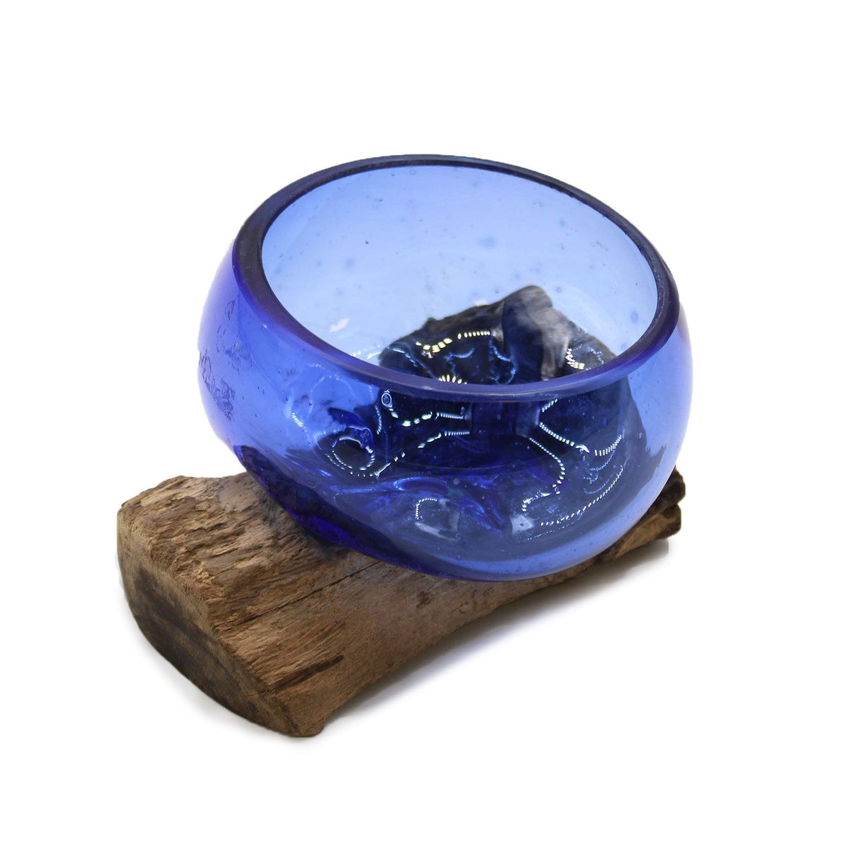 Mini blue glass bowl fitted to an irregular wooden base on a white background