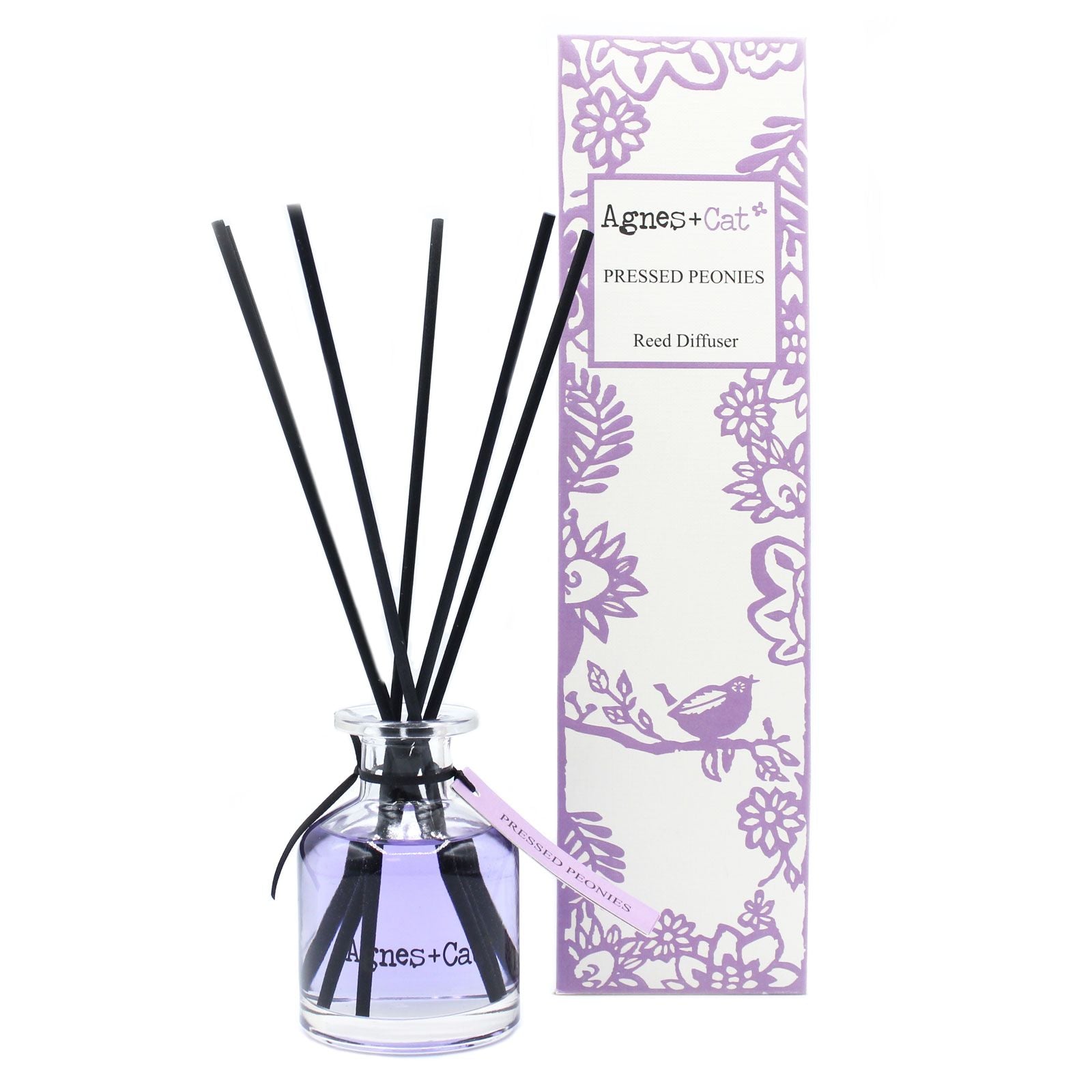 Agnes + Cat Pressed Peonies reed diffuser in a glass bottle with black reeds and floral packaging