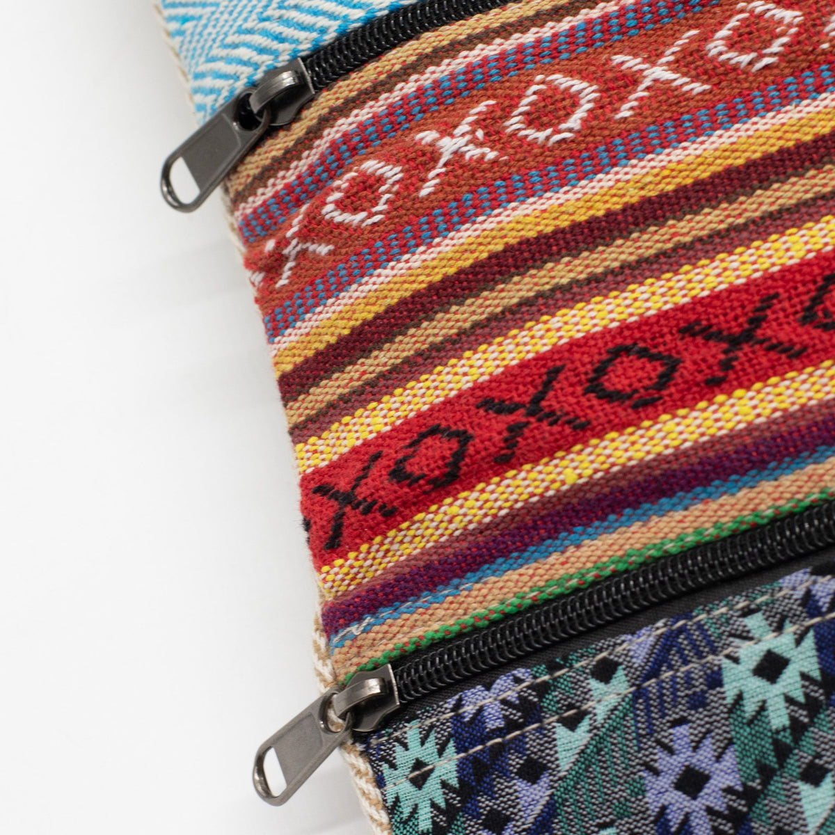 Close-up of two exterior zip pockets and colourful woven panels on the Kathmandu tote.
