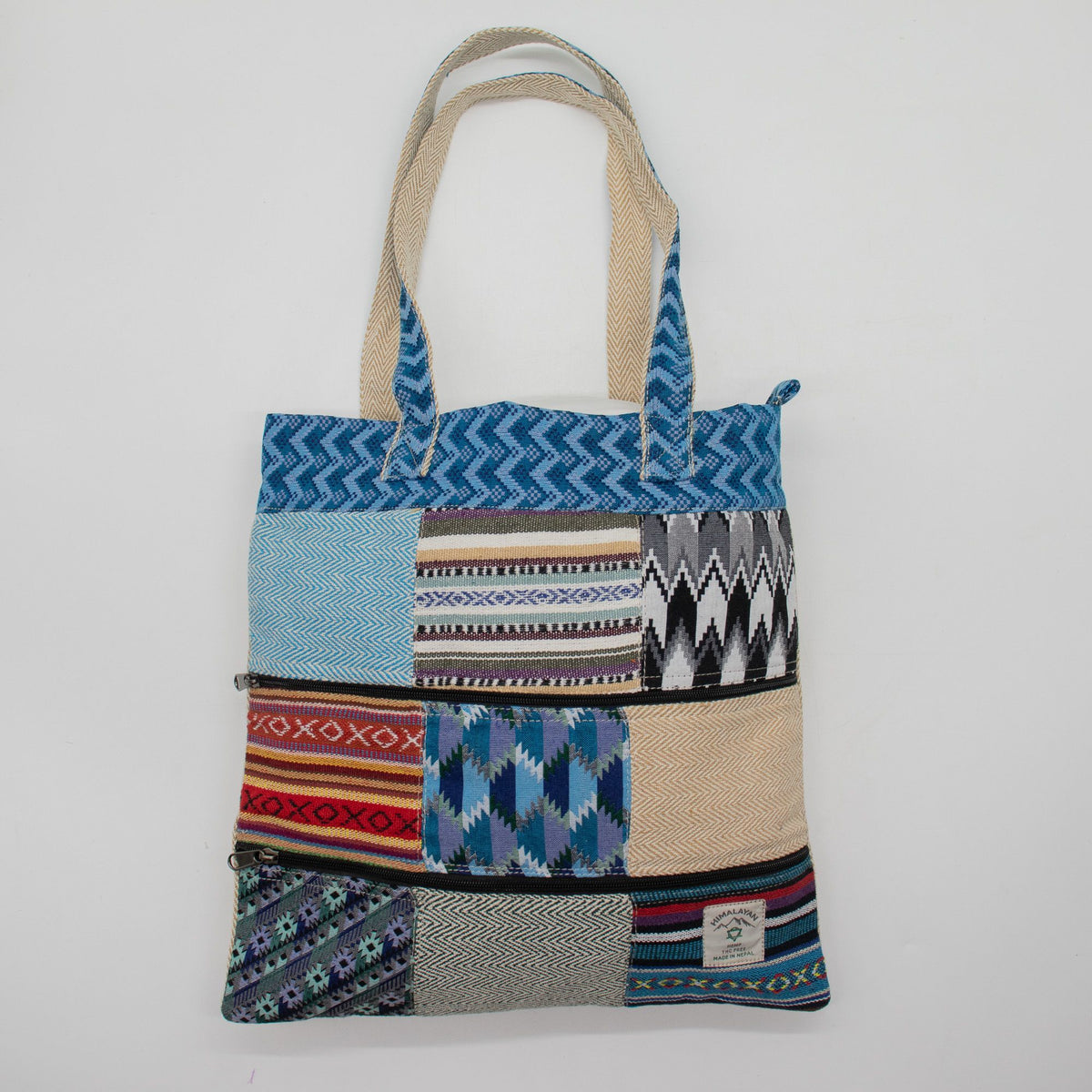 Multicoloured patterned tote bag on a grey background