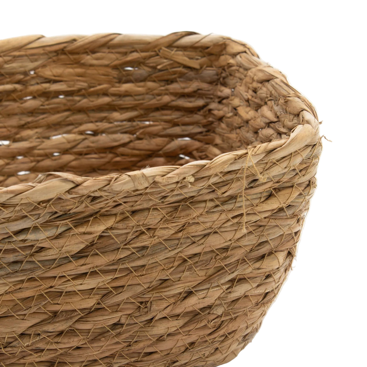 Close-up of a woven basket with a white background