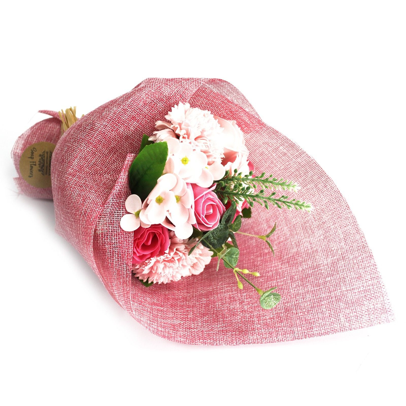 Bouquet of pink and white flowers wrapped in red paper on a white background