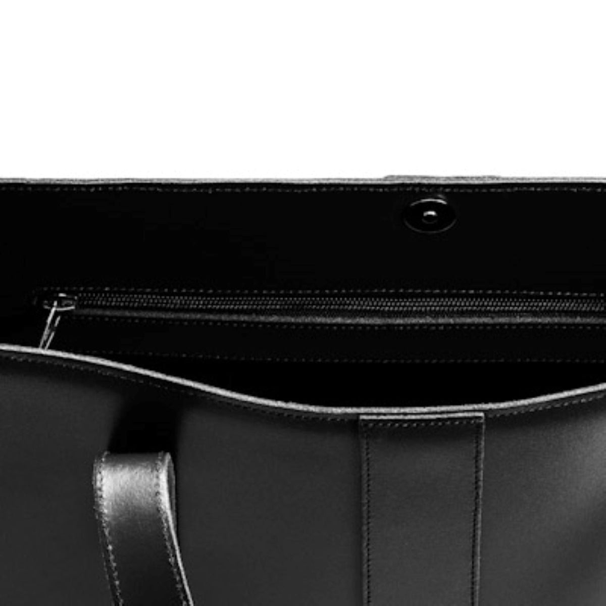 Inside the black Zatchels leather shopper, showing the magnetic fastening and zipped side pocket