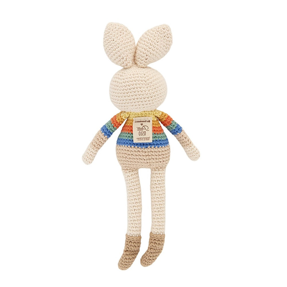 Back of Bonnie Bunny crochet toy showing rainbow stripes and sewn brand label.