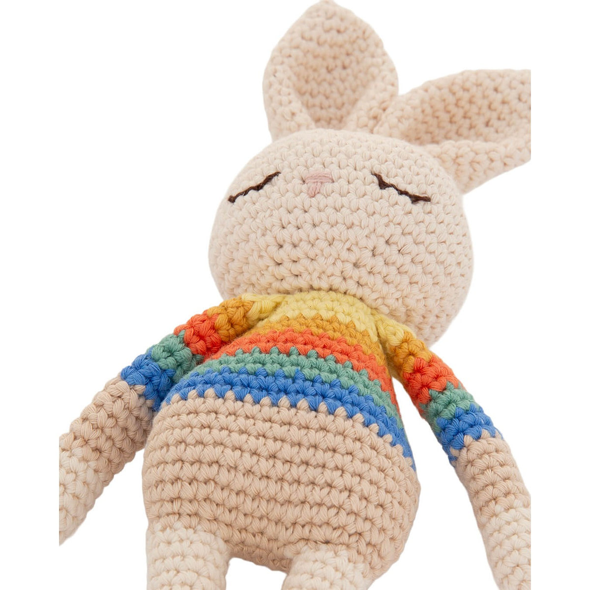 Close-up of Bonnie Bunny’s textured crochet stitches, embroidered face and rainbow stripe jumper