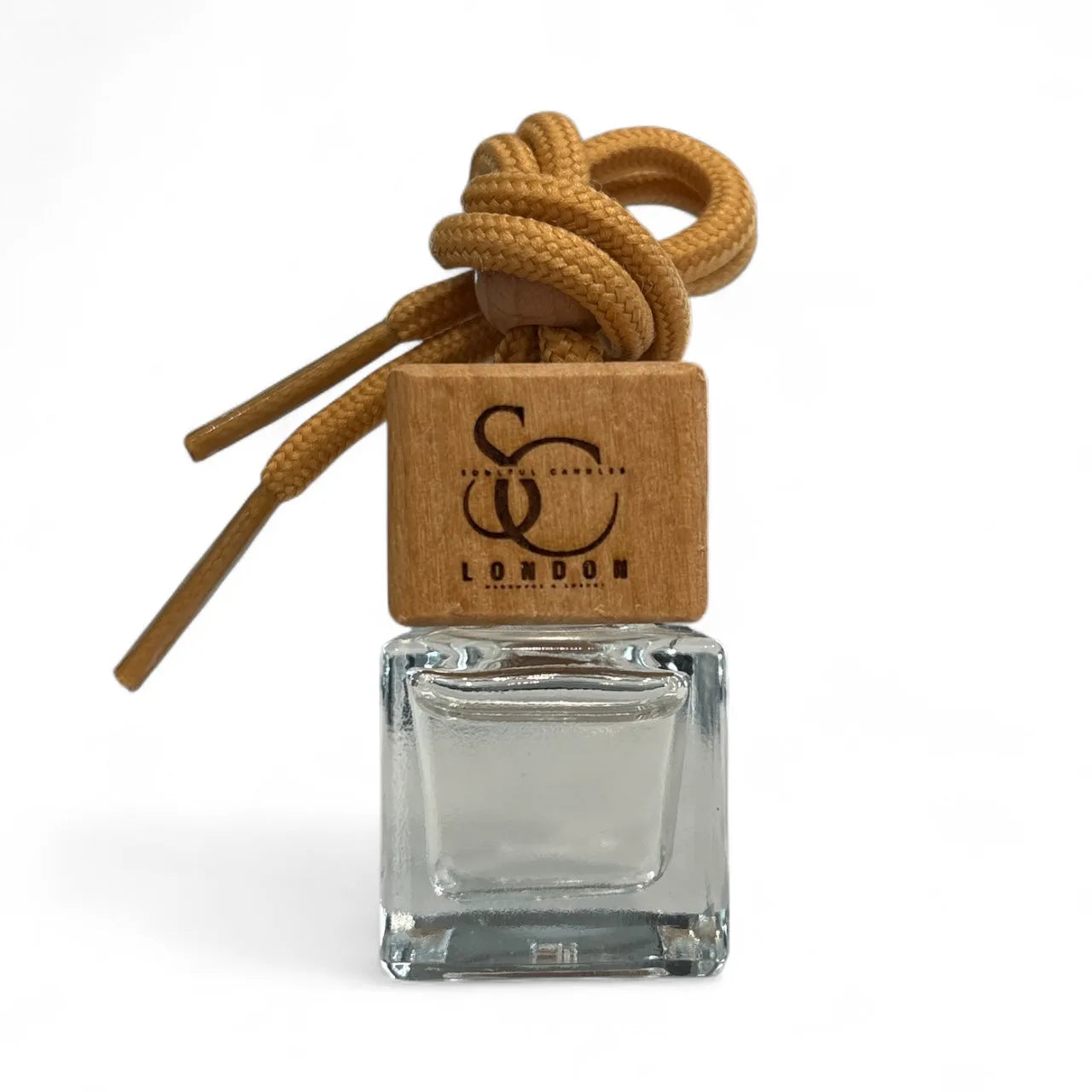 A premium car diffuser in a clear glass bottle with a wooden cap and brown rope on a white background