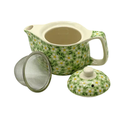 Ceramic teapot with floral pattern, mesh filter, and lid on a white background