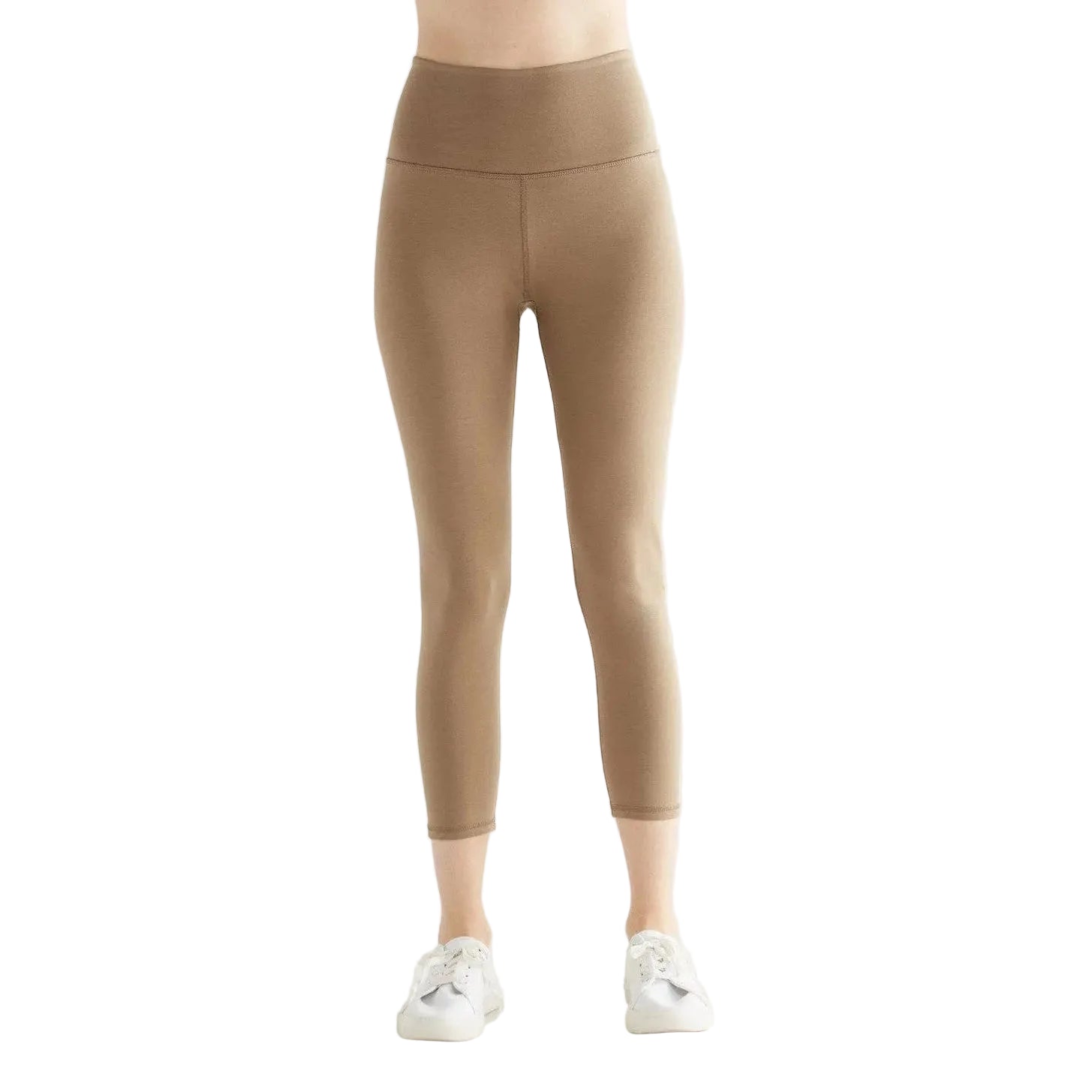 Tan leggings worn by a person on a white background