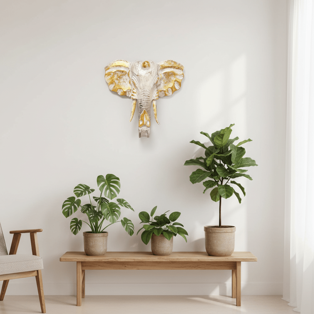 Decorative elephant wall art above a wooden bench with potted plants in a minimalistic room.
