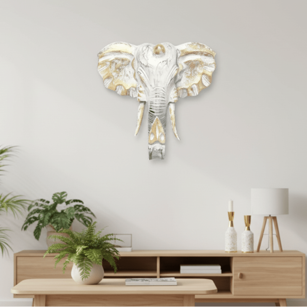 Living room with a decorative elephant wall art piece.