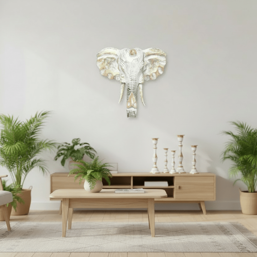 Living room with a decorative elephant wall art piece.