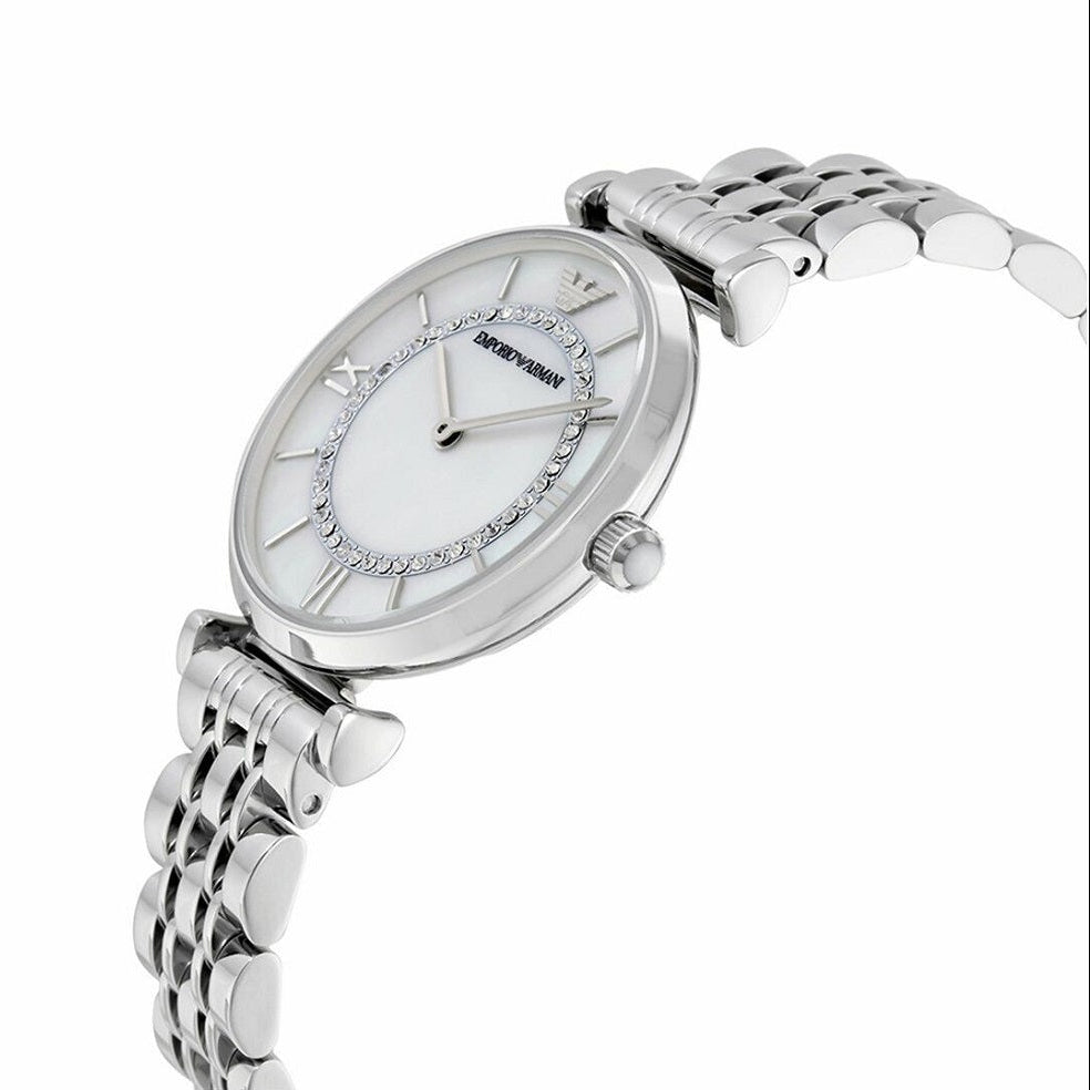 Silver watch with a white face on a white background