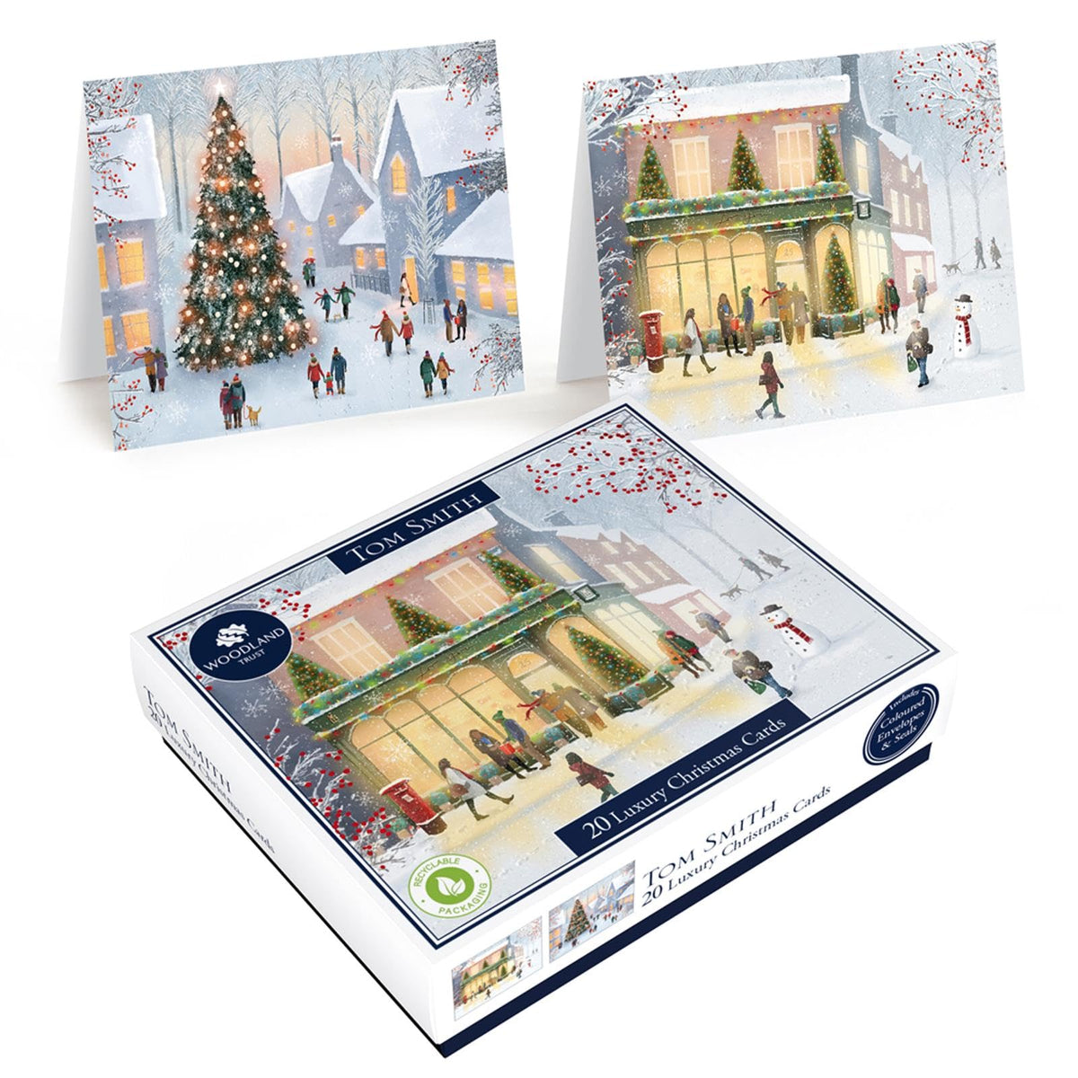 Tom Smith box of 20 Christmas cards with snowy town scenes, a decorated Christmas tree and a warmly lit festive building.