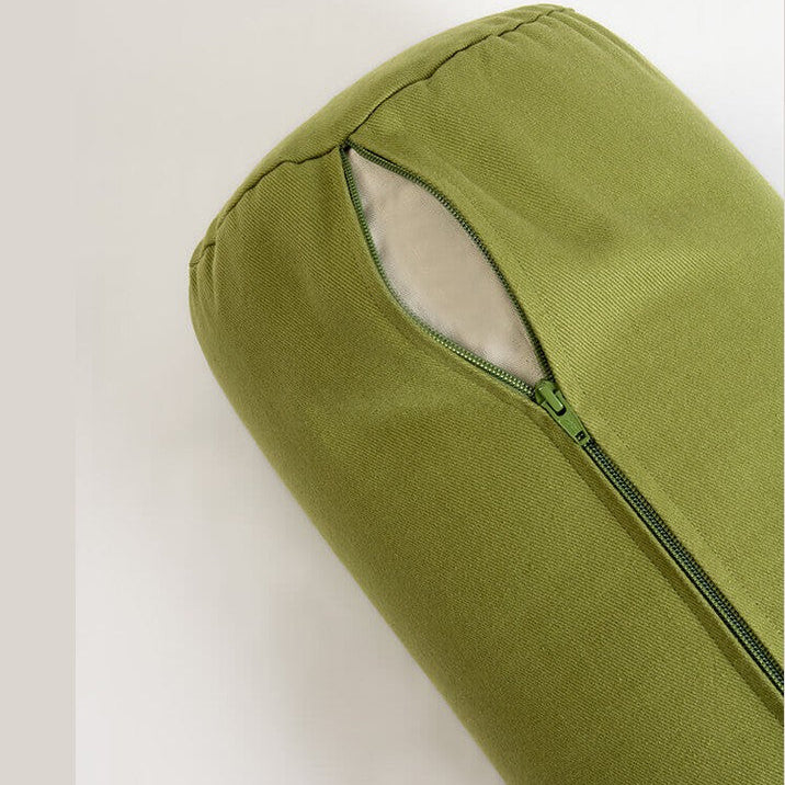 Green pillow with a zipper on a white background