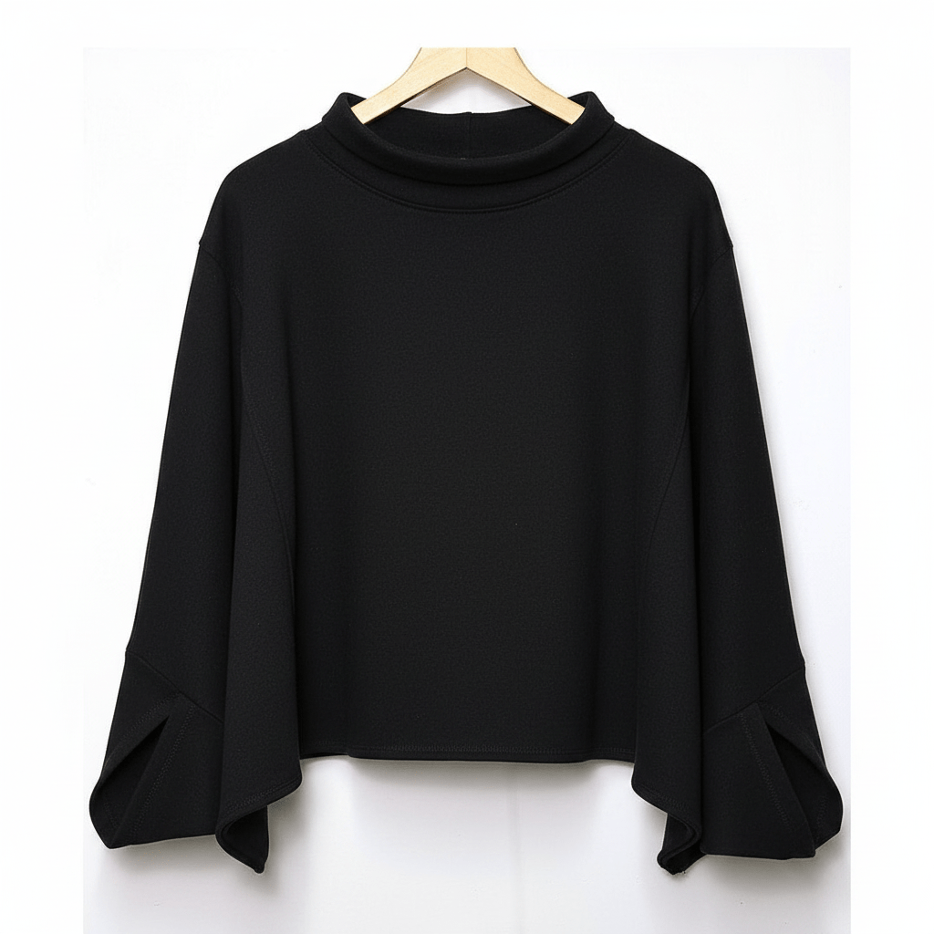 Black sweater on a wooden hanger against a white background