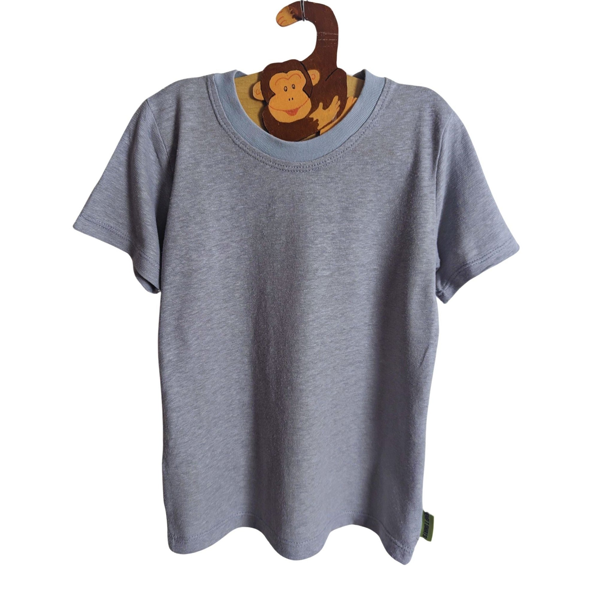 Gray t-shirt on a hanger with a monkey design against a white background