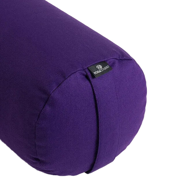 Purple yoga bolster with a brand label on a white background