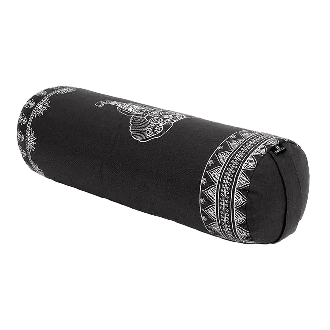 Black cylindrical yoga bolster with white patterns on a light gray background