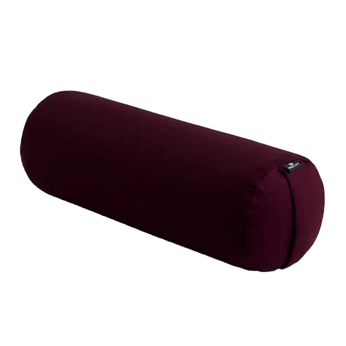 Maroon yoga bolster on a light gray background