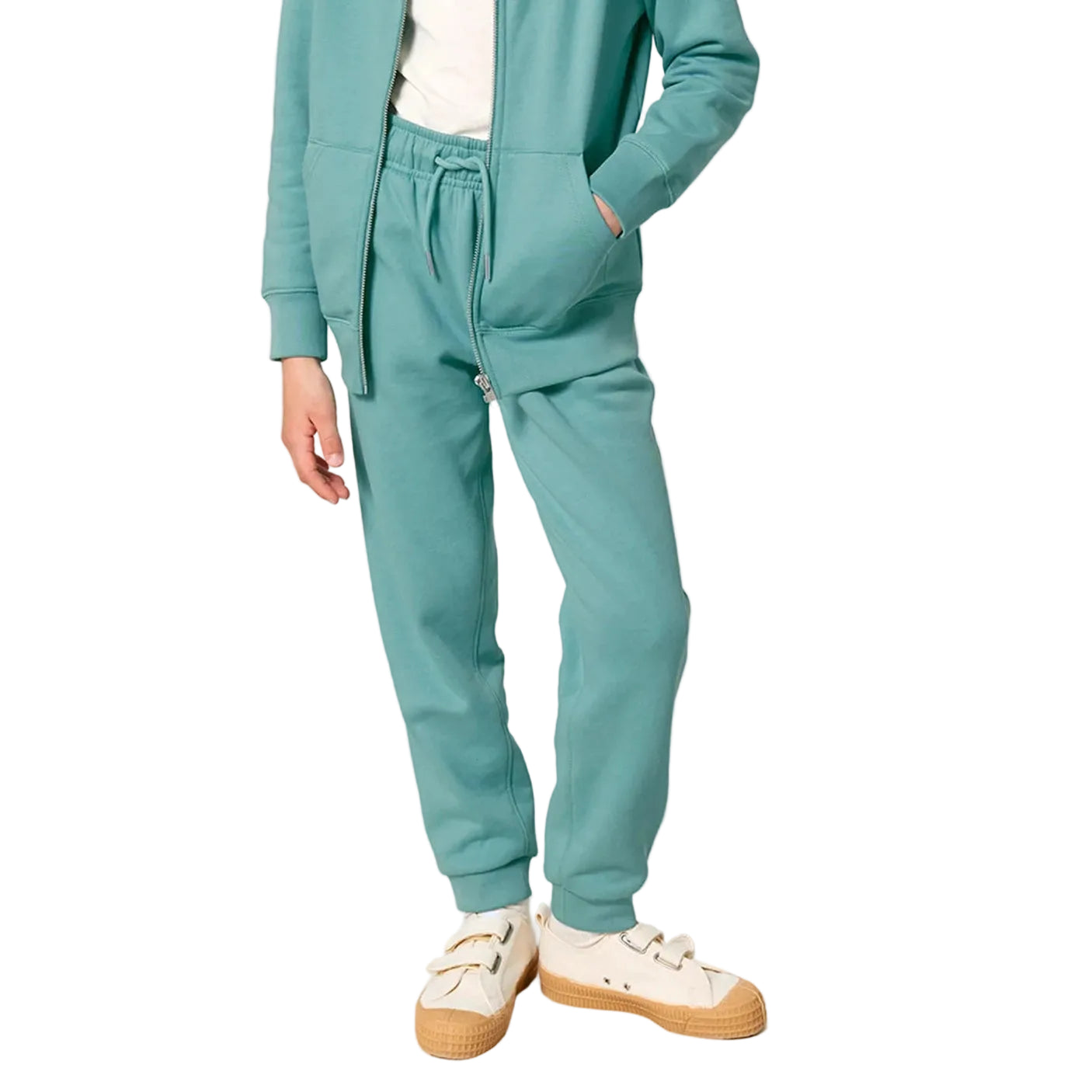 Teal tracksuit with white sneakers on a white background